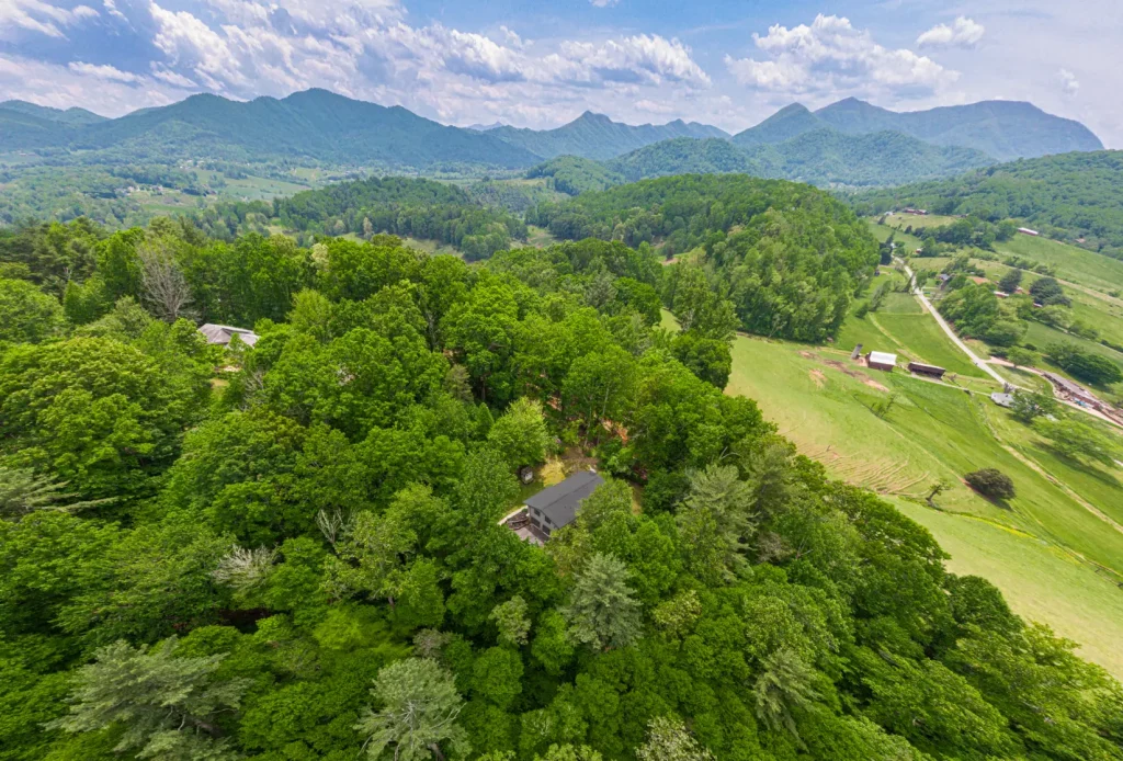 Arial view of Otter House Wellness from above with the mountains off in the distance.